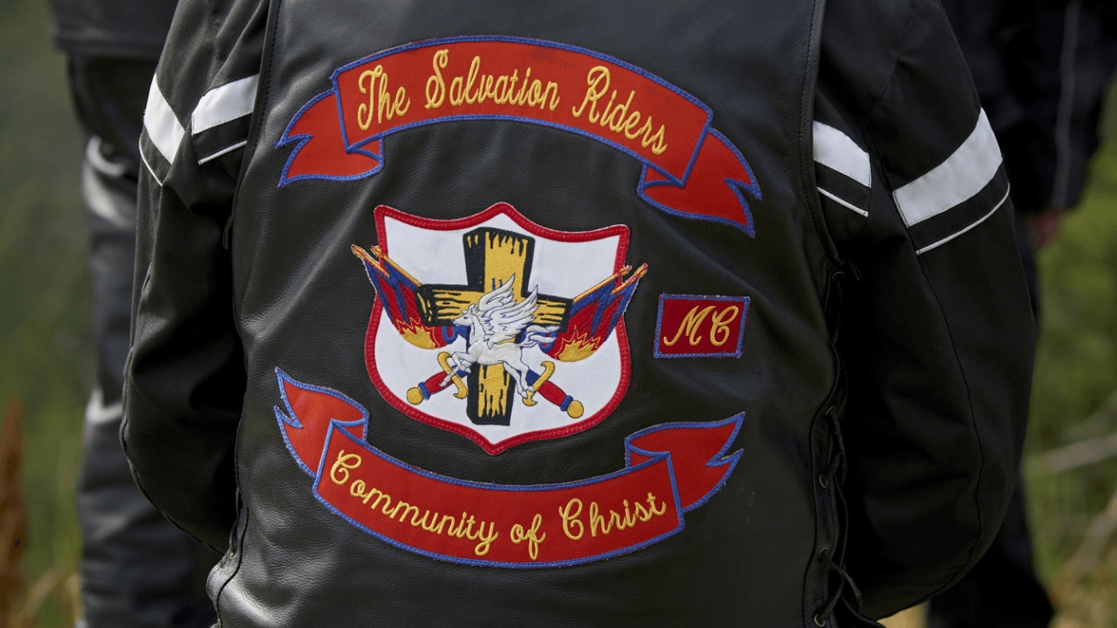 Ryggtavla med logga The Salvation Riders Community of Christ 